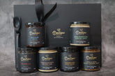 Gourmet sauce gift set by Boutique Sauces featuring Beef & Rib Sauce, Red Wine Jus, Diane Sauce with Buttery Leek, Green Peppercorn & Brandy Sauce, Orange Star Anise Sauce, and Vanilla Bean Salted Caramel Sauce. The perfect foodie gift for home cooks and entertainers